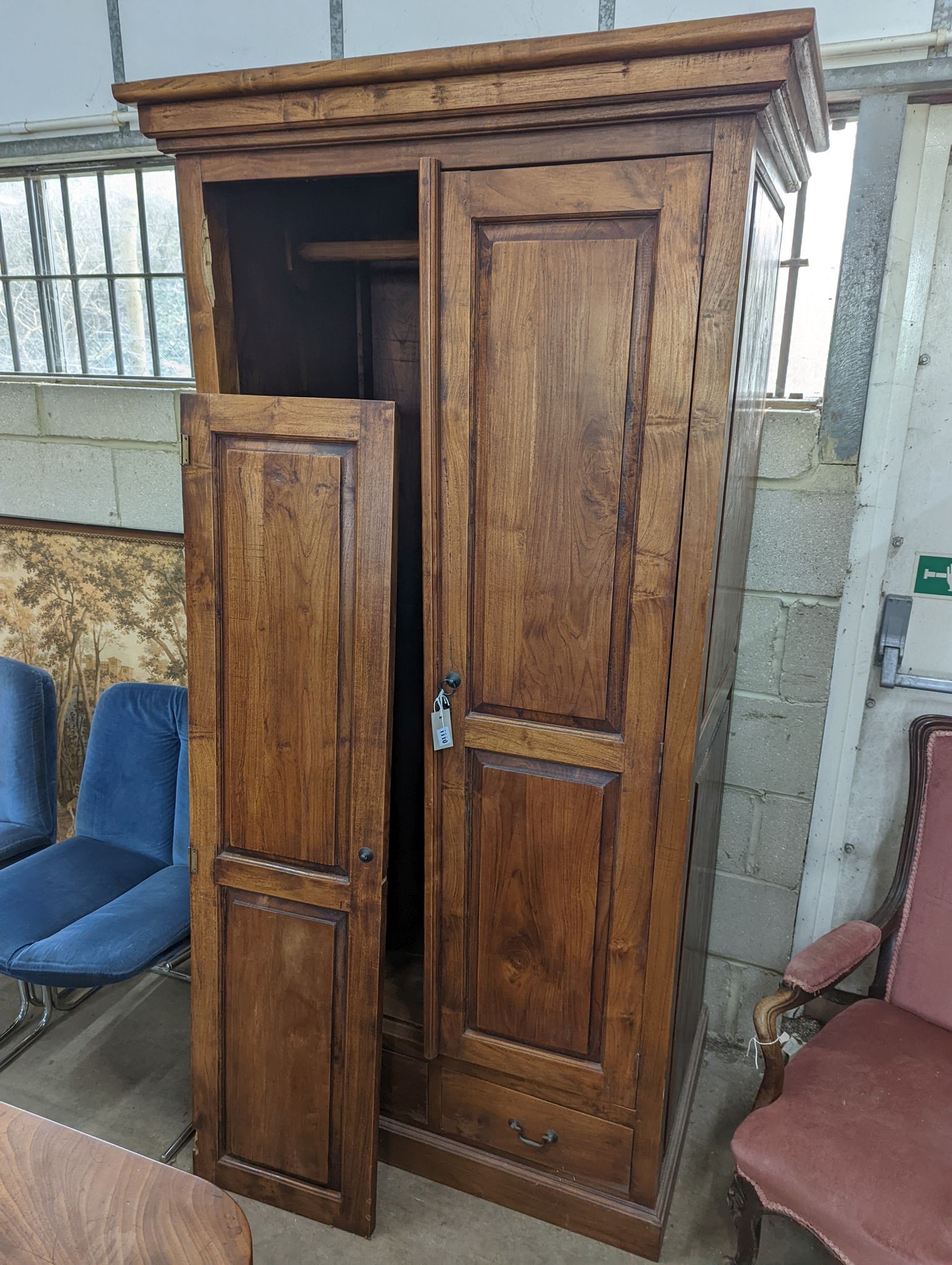 An Indonesian hardwood 2 door wardrobe (damaged), length 100cm, depth 66cm, height 200cm